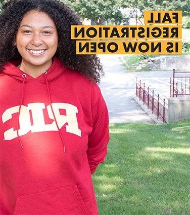 Student smiling in RIC sweatshirt-promoting fall registration now open